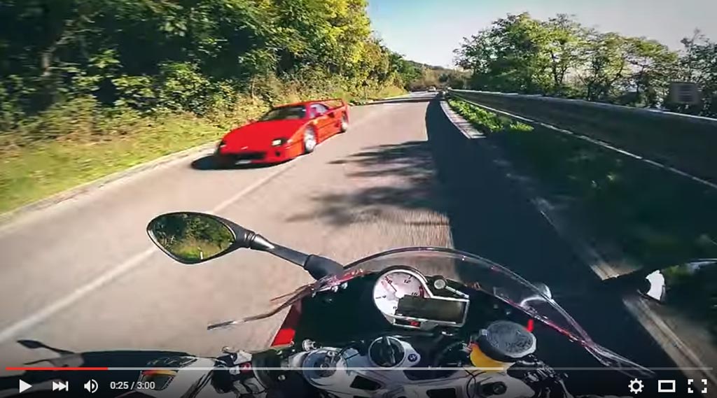 Intense Racing Action Of The BMW S1000RR Versus The Ferrari F40