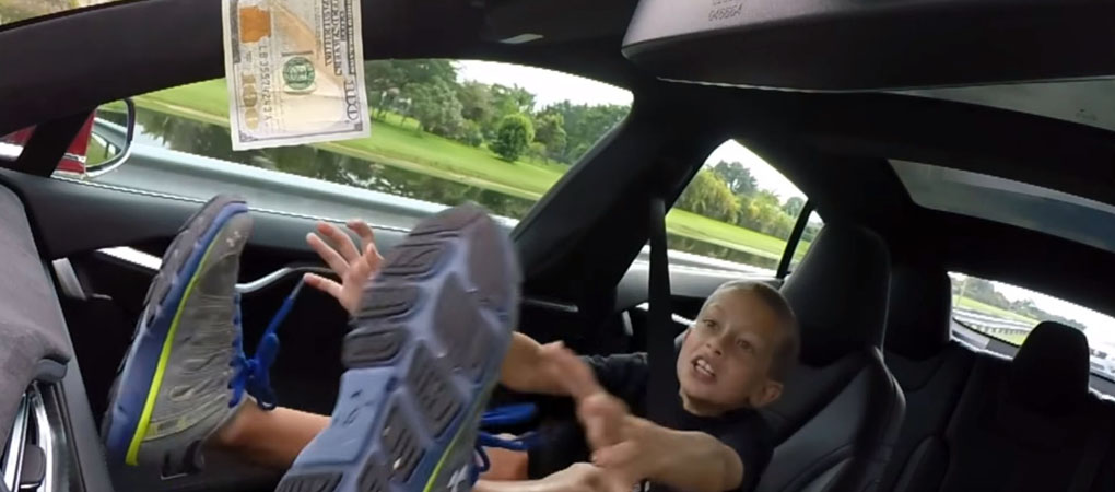 Kid Trying To Reach A $100 Bill On The Dash Of The P90 D While His Dad Is Accelerating Is Hilarious